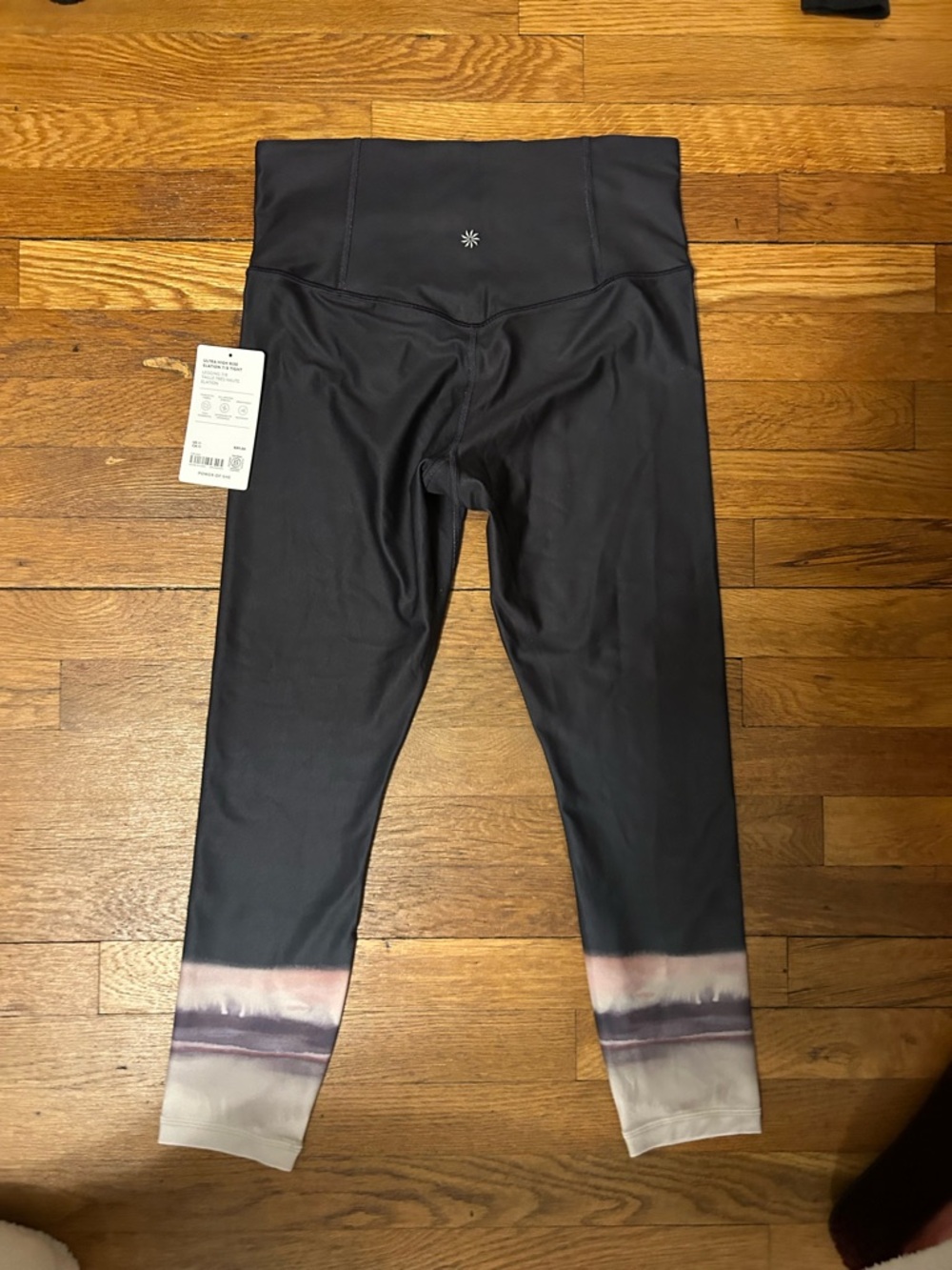 Athleta black leggings with pink and purple ombre design. Size M. NWT